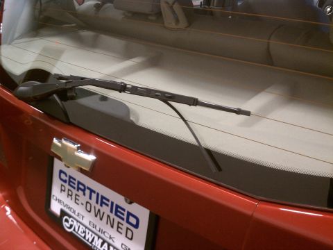 1998 Toyota Camry - Rear view of a red Chevrolet showing the wiper and a certified pre-owned license plate.