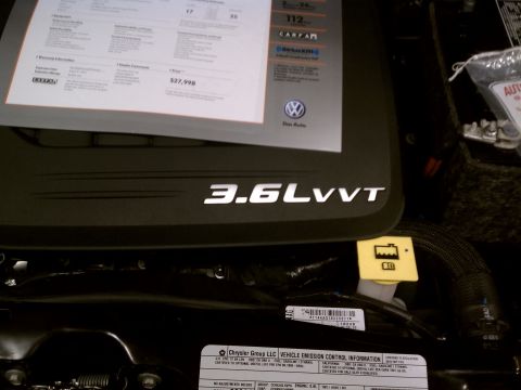 1998 Toyota Camry - Close-up of an engine bay showing the '3.6LVVT' designation and various labels.