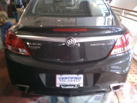 1998 Toyota Camry - Rear view of a dark gray sedan, identified as a Regal GS, with a 'Certified Pre-Owned' license plate.
