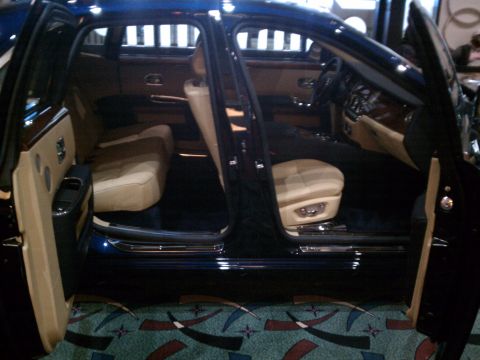 1998 Toyota Camry - The spacious interior of a luxury sedan features plush tan leather seats and elegant wood accents.