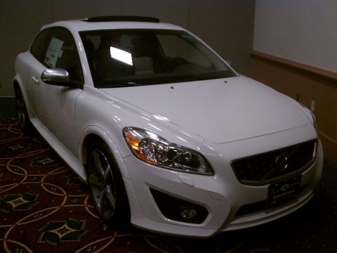 1998 Toyota Camry - A white Volvo C30 is parked indoors on a patterned carpet.