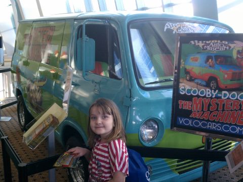 1998 Toyota Camry - The iconic Mystery Machine van, famous from Scooby-Doo, is displayed at an auto museum.
