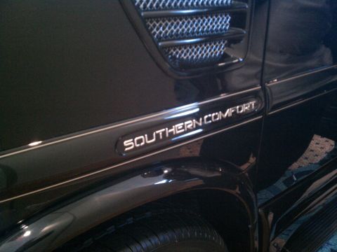 1998 Toyota Camry - Close-up of the side of a black van showing the