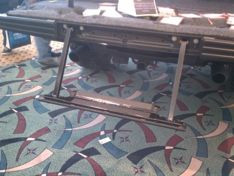 1998 Toyota Camry - Close-up of a retractable step mechanism on a vehicle's undercarriage.