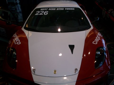 1998 Toyota Camry - A red and white race car, identified by the number 226 and 'WEST BEND DYNO TUNING' text, is shown from the front.
