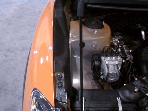 1998 Toyota Camry - ABS module and air intake components visible in the engine bay of a car.