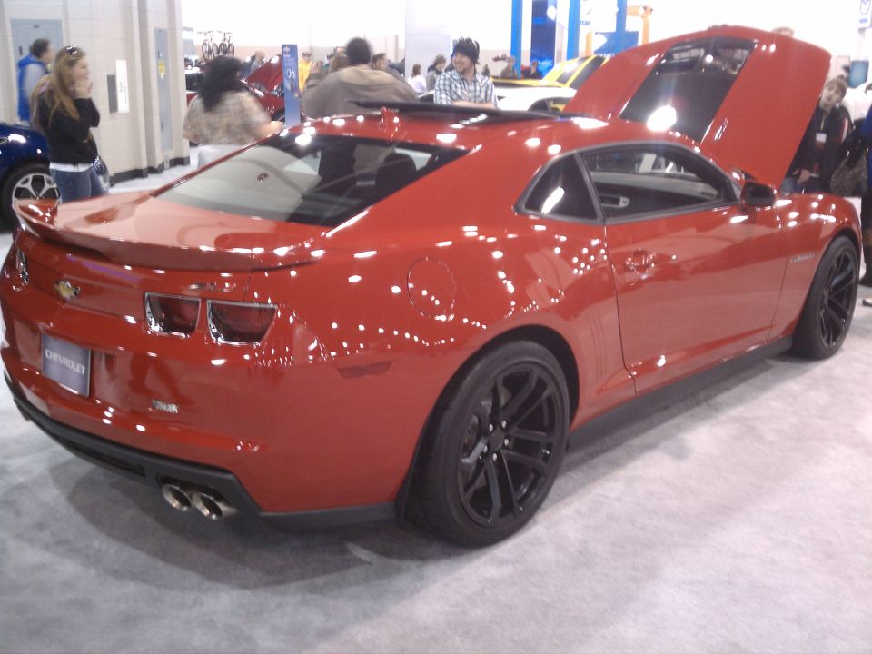 Red Chevrolet Camaro rear 3/4 view, hood and trunk open
