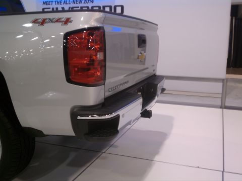 1998 Toyota Camry - Rear view of a silver 2014 Chevrolet Silverado pickup truck at an auto show.