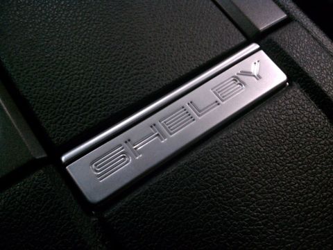 1998 Toyota Camry - Close-up of a Shelby badge on the interior trim of a vehicle.