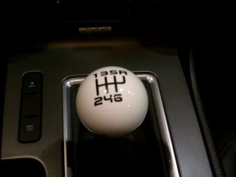 1998 Toyota Camry - Close-up of a white manual transmission shift knob with a visible gear pattern.