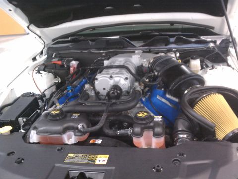 1998 Toyota Camry - The engine bay features a prominent supercharger and a large yellow air filter, indicating performance modifications.