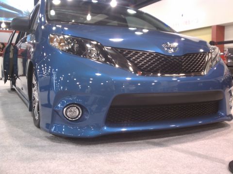 1998 Toyota Camry - A blue Toyota minivan is displayed with its driver door open, showing off its front grille and fog lights.