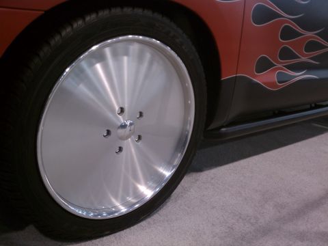 1998 Toyota Camry - Vehicle side view showing a custom wheel and flame graphics.