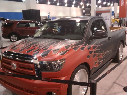 1998 Toyota Camry - This modified Toyota Tundra pickup truck features a distinctive flame graphic paint job and custom wheels.