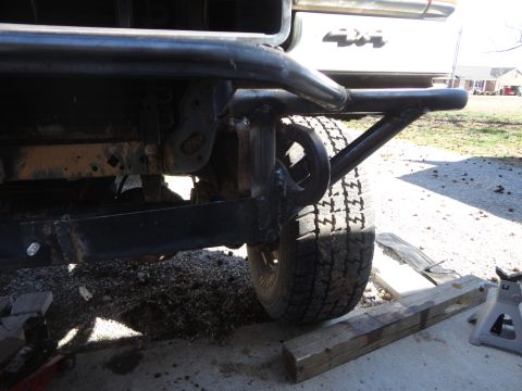 1990 Ford Bronco - A custom front bumper with a tow hook is attached to a vehicle that has '4x4' badging visible.