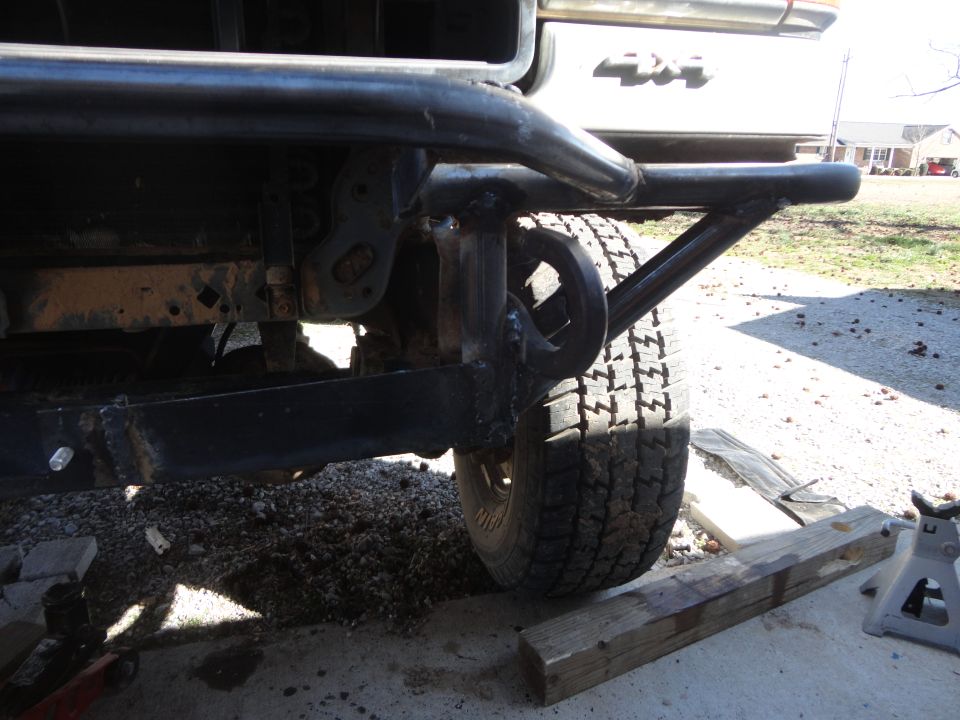 Custom front bumper with tow hook on a vehicle with '4x4' badging