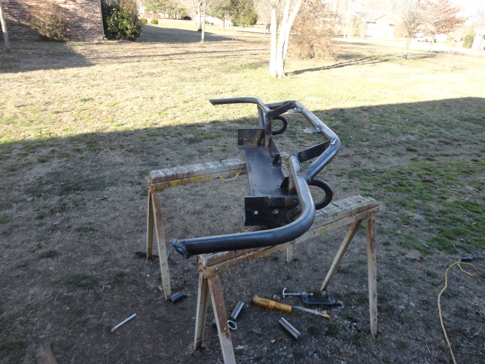 Custom front bumper with tow hooks on sawhorses