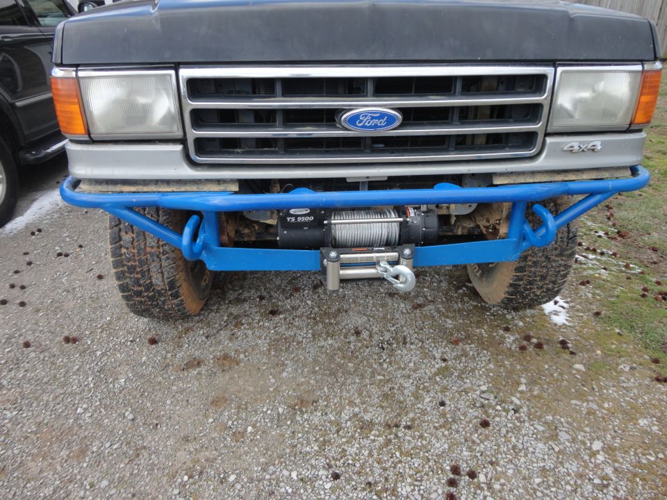 1990 Ford Bronco front bumper with blue tubing and winch