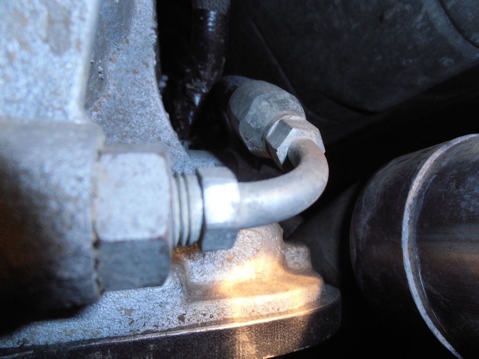 Close-up of metal tubing and engine components