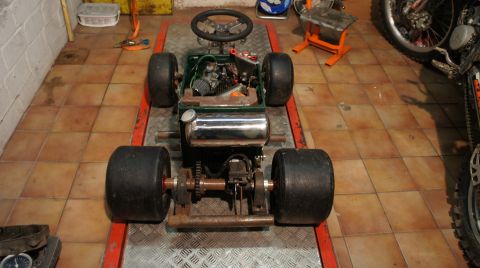 1973 Ford Ranchero - This custom go-kart is on a lift, revealing its engine and drivetrain components.
