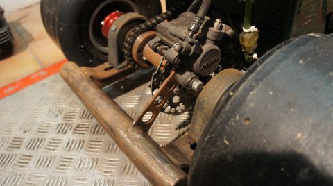 1973 Ford Ranchero - Rear axle assembly of a go-kart with chain drive and brake caliper visible.