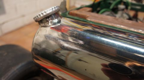 1973 Ford Ranchero - A close-up of a shiny chrome tank with a cap, possibly for fluids.