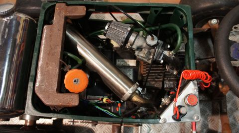 1973 Ford Ranchero - Close-up view of a custom engine compartment, showing various mechanical components and wiring.