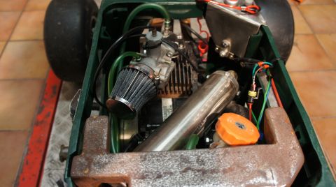 1973 Ford Ranchero - Close-up of a kart's engine, showing aftermarket parts like the air filter and exhaust.