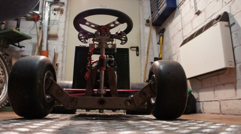 1973 Ford Ranchero - Front view of a go-kart chassis, showing the steering mechanism and wheels.