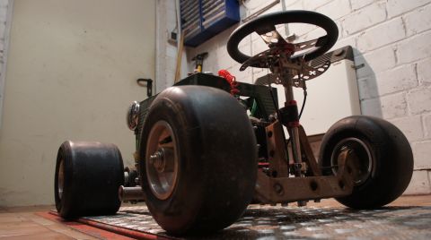 1973 Ford Ranchero - A custom-built go-kart is viewed from a low angle in what appears to be a garage or workshop.