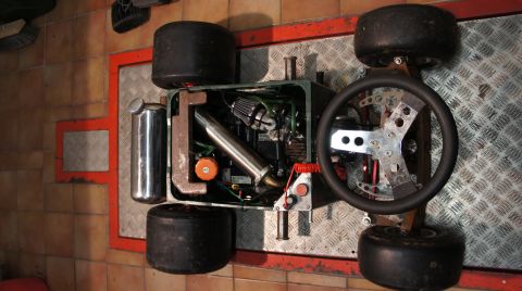 1973 Ford Ranchero - A custom-built go-kart chassis is displayed with its engine and steering wheel visible.