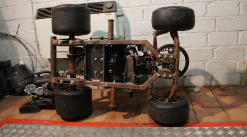 1973 Ford Ranchero - This custom-built go-kart chassis features an exposed engine and four small wheels, suggesting a project in progress.