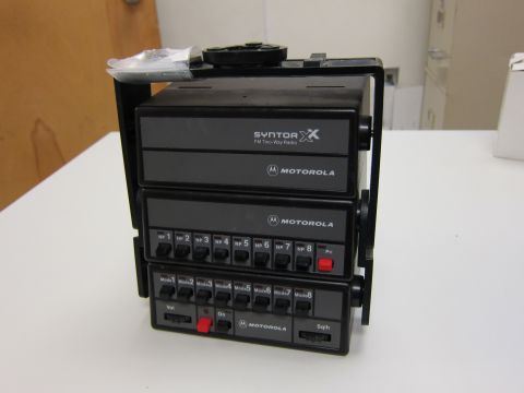 2001 Ford Crown Victoria - This image shows a Motorola Syntor X FM Two-Way Radio, a communication device with numerous controls and indicators.