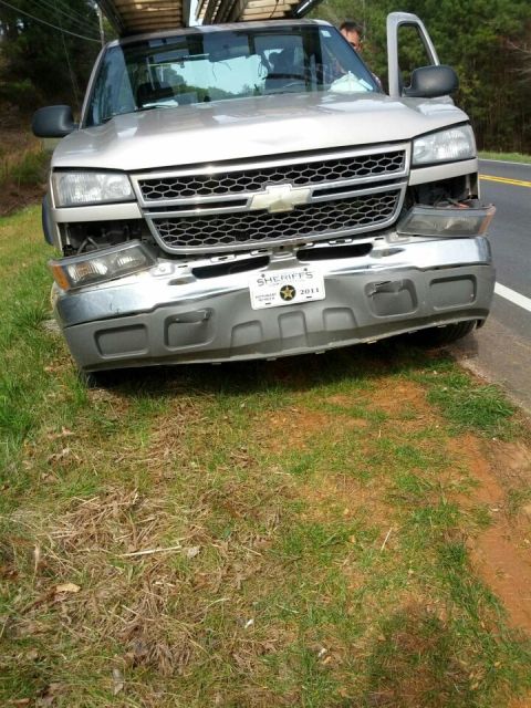 1979 Ford F-150 - This Chevrolet Silverado 1500 has a damaged front end and is parked on the side of the road.