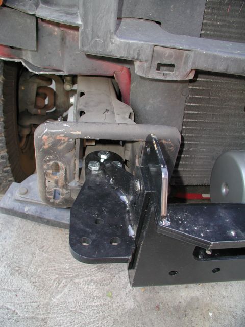 2001 Ford Excursion - Winch cradle mounts in tow hook holes. Bumper hangs on winch mount.