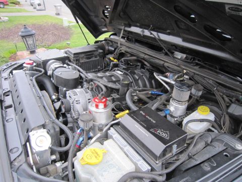 2008 Jeep Wrangler - Engine bay of a 2007 Jeep Wrangler showing aftermarket performance modifications.