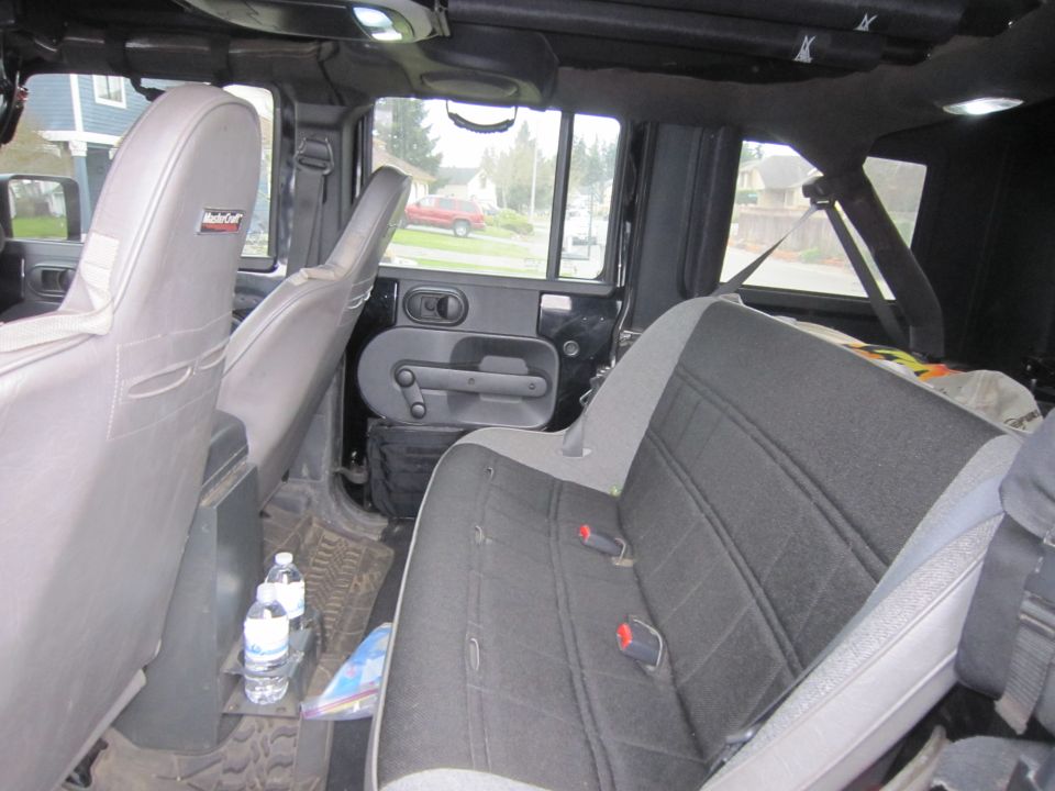 Interior view of a 2008 Jeep Wrangler showing rear seats and door panel