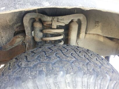 1995 Ford Bronco - Rigged coil tab to hold it in place until replacement coils are ordered.