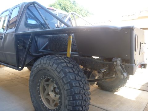 1997 Ford Ranger - This heavily modified truck features a custom roll cage and large tires, suggesting it's built for off-road use.