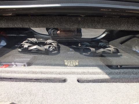 2003 Ford Crown Victoria - Under-deck audio shelf with two chrome amps, a sub and a Transformers Autobot badge