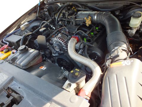 2003 Ford Crown Victoria - Engine bay detail with stainless braided hose, chrome alternator and a K&N cone filter at right