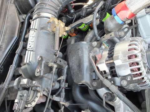 2003 Ford Crown Victoria - Aftermarket BBK upper intake on a V8 with throttle linkage, alternator and stainless braided hose