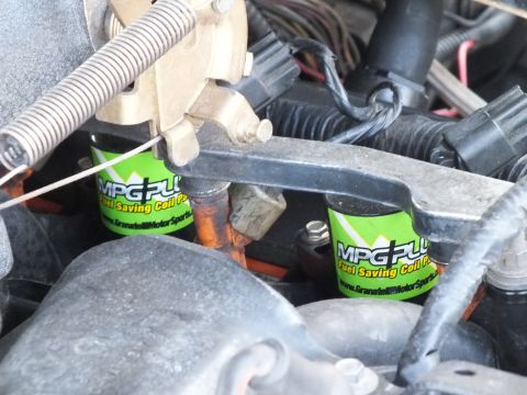 2003 Ford Crown Victoria - Pair of green MPG Plus coil-pack devices clamped over ignition coils on the engine