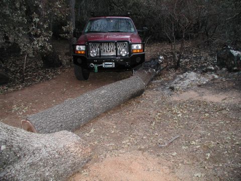 2001 Ford Excursion - Using new bumper as a bump stop while clearing a road in Julian, CA after the fires.