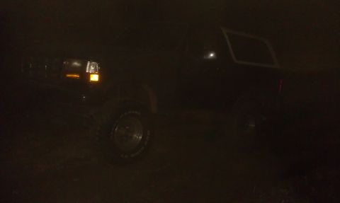 1993 Ford Bronco - This 1993 Ford Bronco is seen from a 3/4 front angle in low light conditions.