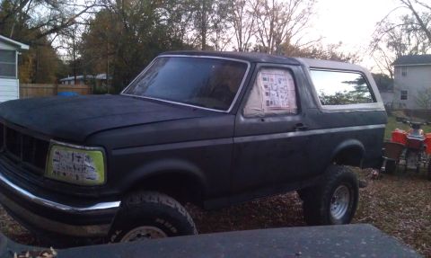 1993 Ford Bronco - This 1993 Ford Bronco is seen in a matte black finish with its windows taped for painting.