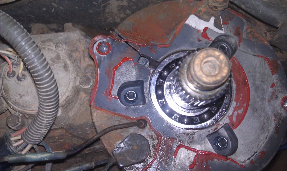 Transfer case part with bearing and red sealant