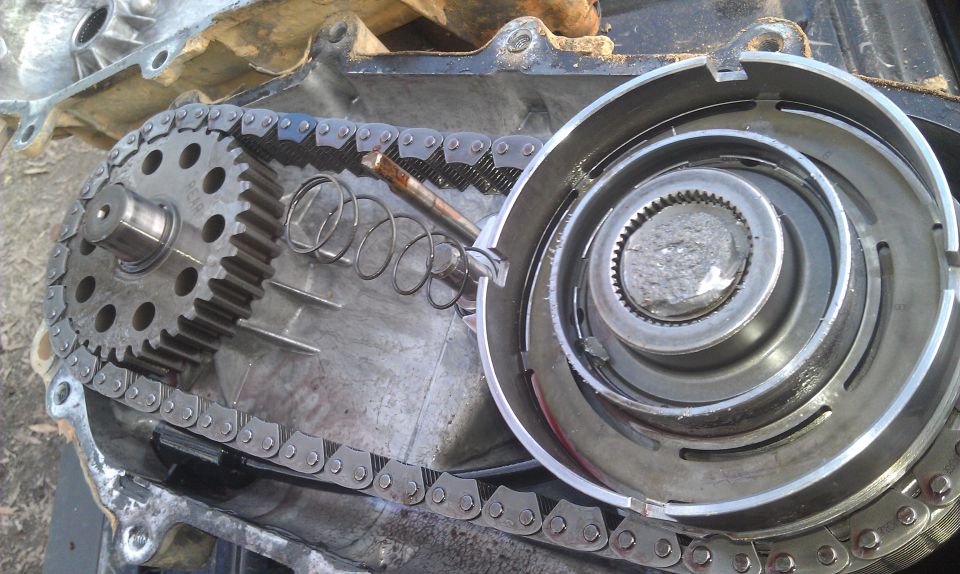 transfer case with chain and gears exposed