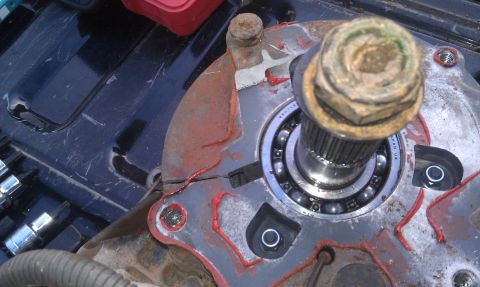 1993 Ford Bronco - Wheel bearing assembly with visible bearing balls and a large hex nut.