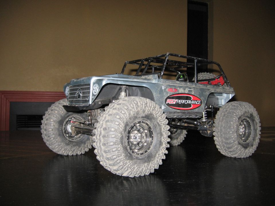 RC rock crawler with large tires and 'Roly Performance' decal